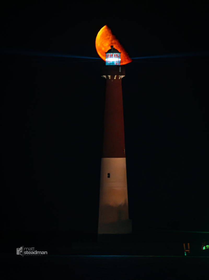 Photo of the Moon Rising over the Barnegat Lighthouse in Long Beach Island, New jersey